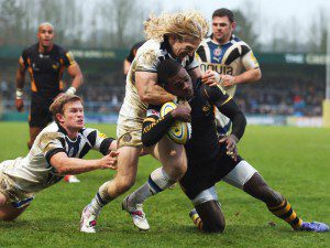 Christian Wade fights of defenders to score try in Wasps victory.
