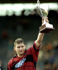 'Hey, aren't you the coach now?' Todd  Blackaddder hoists the 1998 Super Rugby trophy.