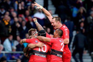 This is team spirit: Toulon players surround Drew Mitchell after his try
