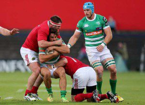 Ludovico Nitoglia of Treviso in a tackle with Munster's James Cronin and Shane Monahan INPHO/Ryan Byrne