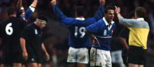 Christophe Lamaison and the French team celebrate after beating New Zealand in 1999