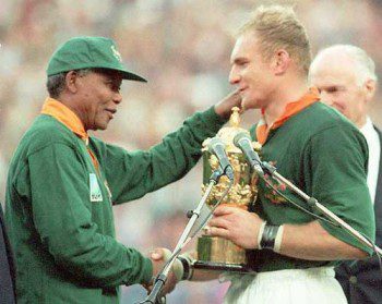 An image burned into history. Nelson Mandela hands the Webb Ellis trophy to Francois Pienaar in 1995