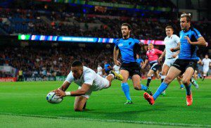 Anthony Watson scores the first of England's 10 tries against Uruguay