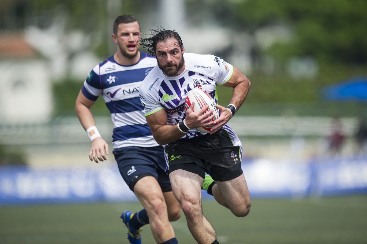 Samurai International (in white) defeats Natixis HKFC (in white and black stripes) 29 to 0 during Day 1 (Pool D) of GFI HKFC Rugby Tens 2016 on 06 April 2016 at Hong Kong Football Club in Hong Kong, China. Photo by Juan Manuel Serrano / Power Sport Images
