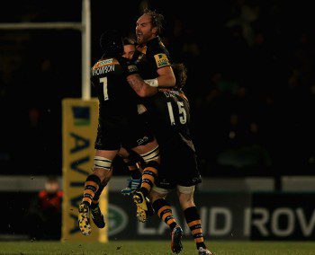 Andy Goode is mobbed by teammates after converting his match winning drop goal