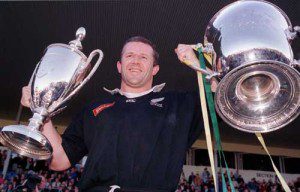 All Black captain Sean Fitzpatrick with the Tri Nations trophy and Bledisloe Cup
