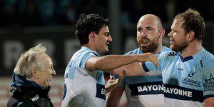 Basquing in glory: Martin Bustos Moyano is congratulated by his team-mates after kicking them to victory in the Top 14 match against Castres